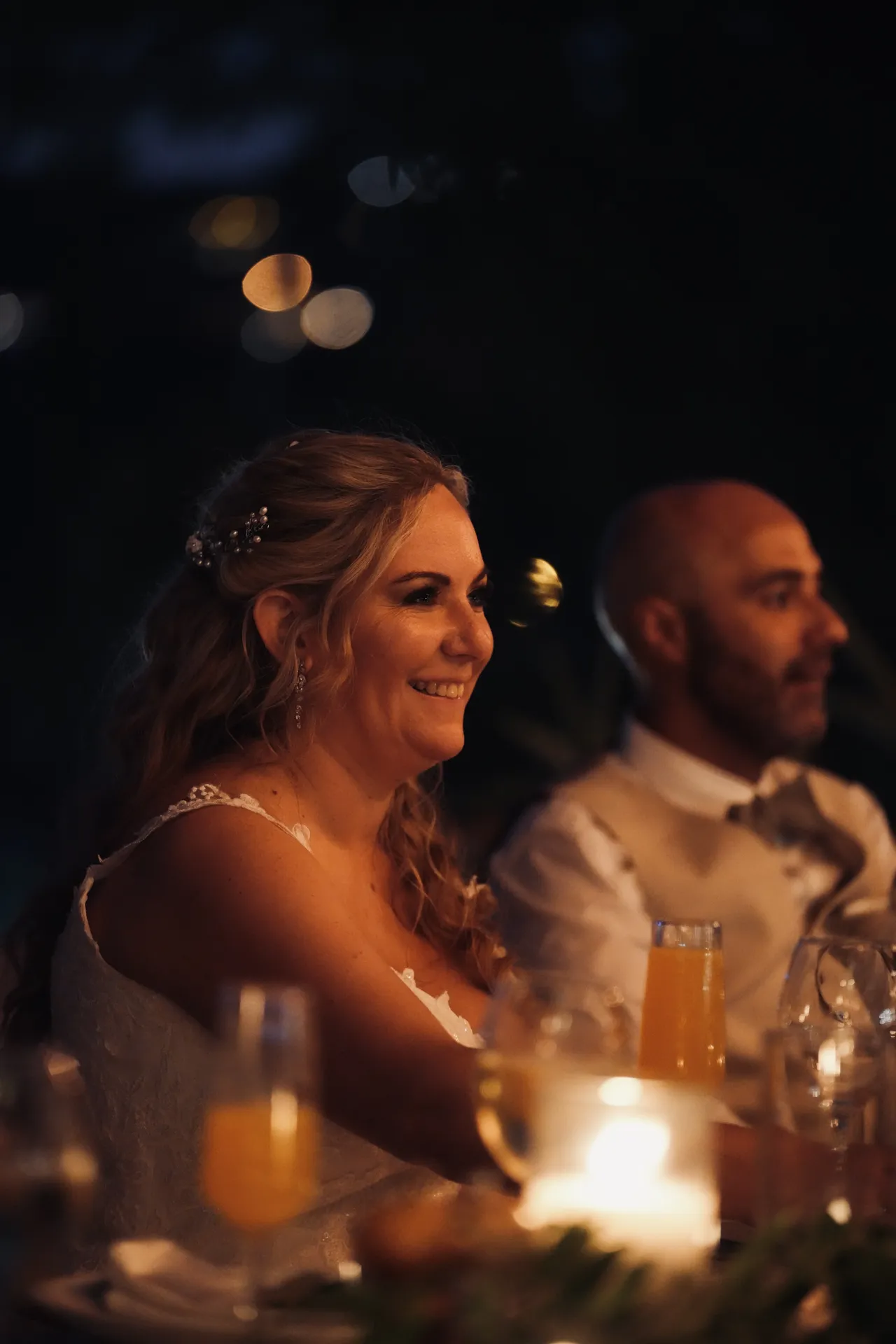 Bride at evening reception with beautiful bokeh lighting effect