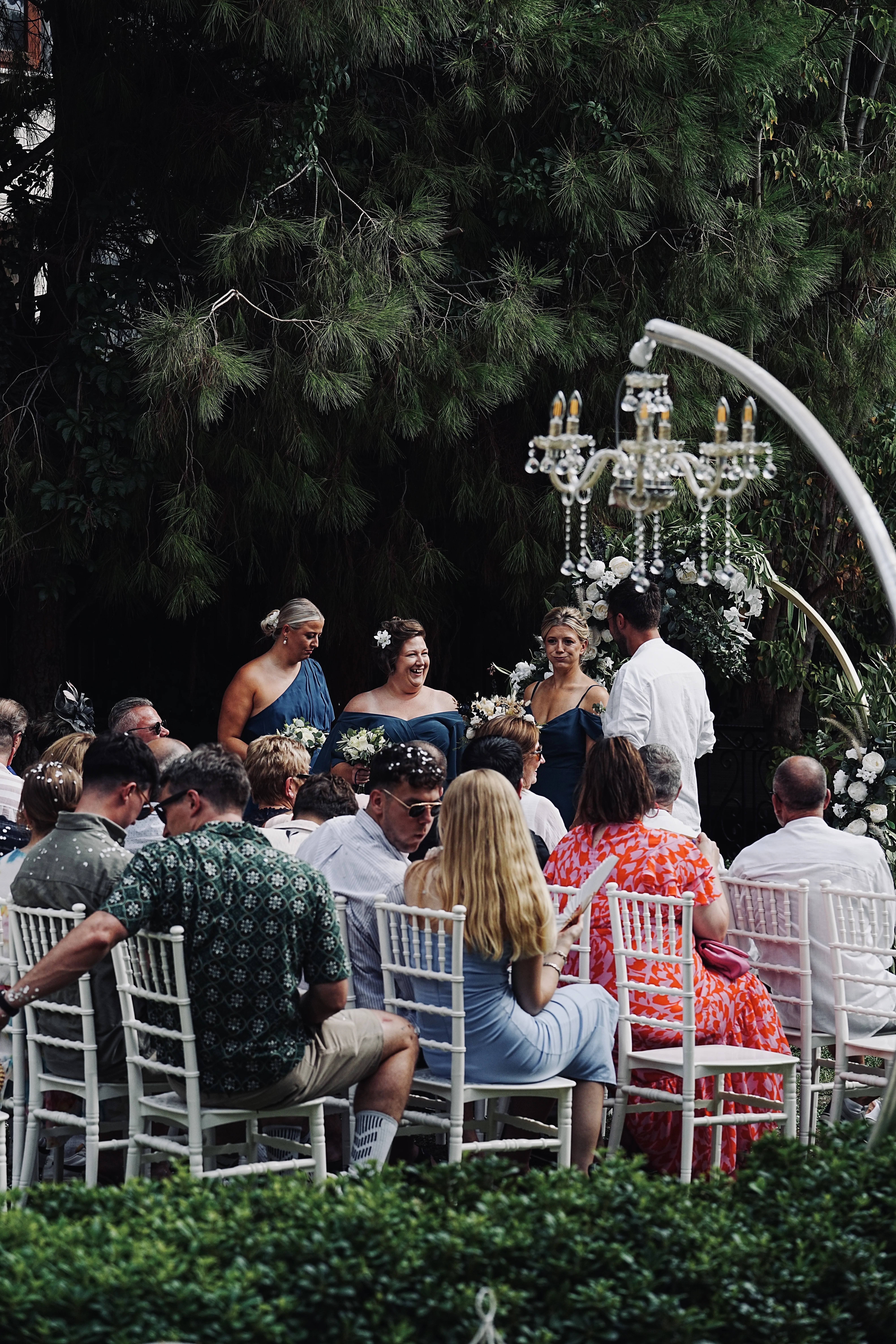 Three bridesmaids in elegant navy blue dresses
