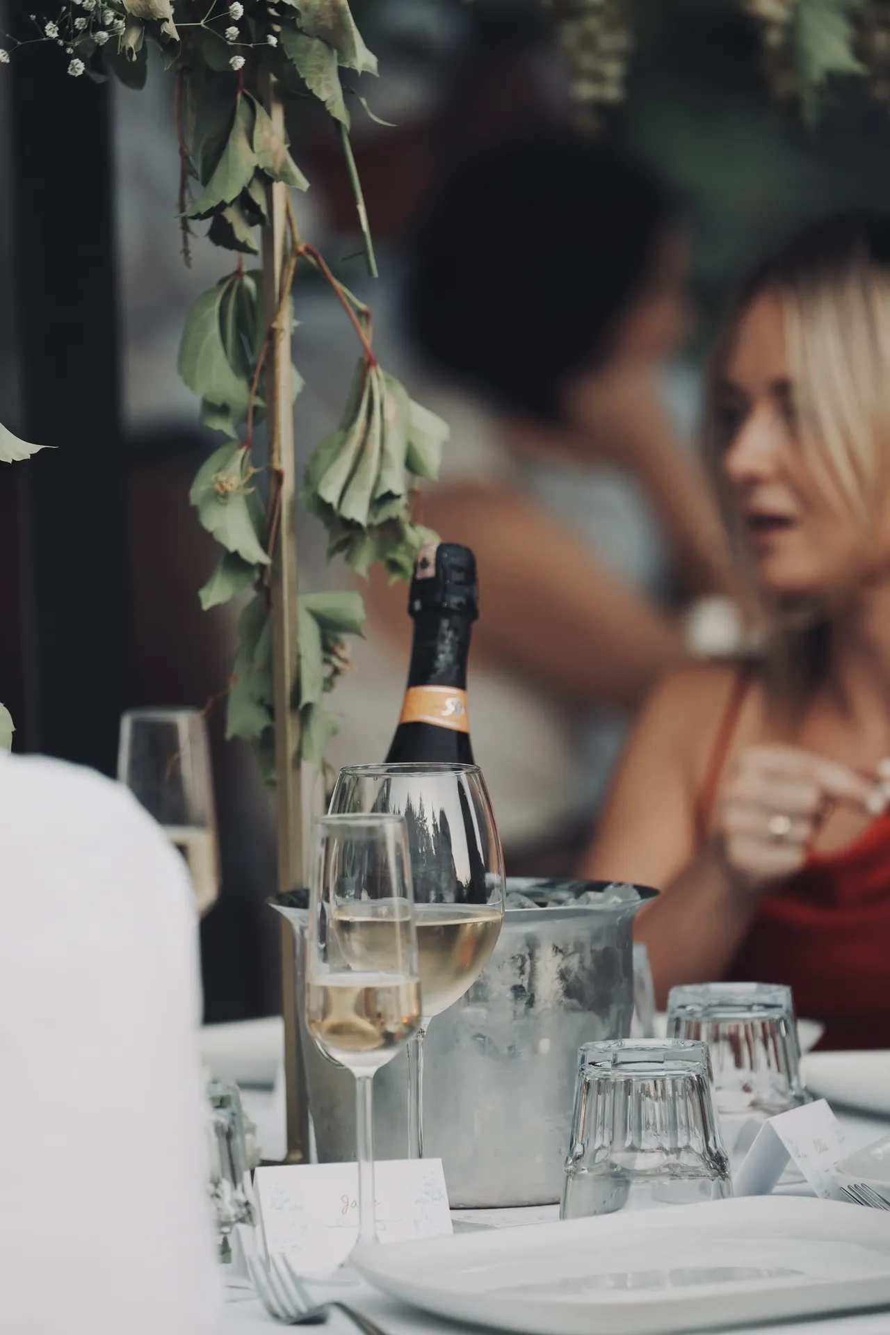 Champagne service with elegant greenery garland centerpiece