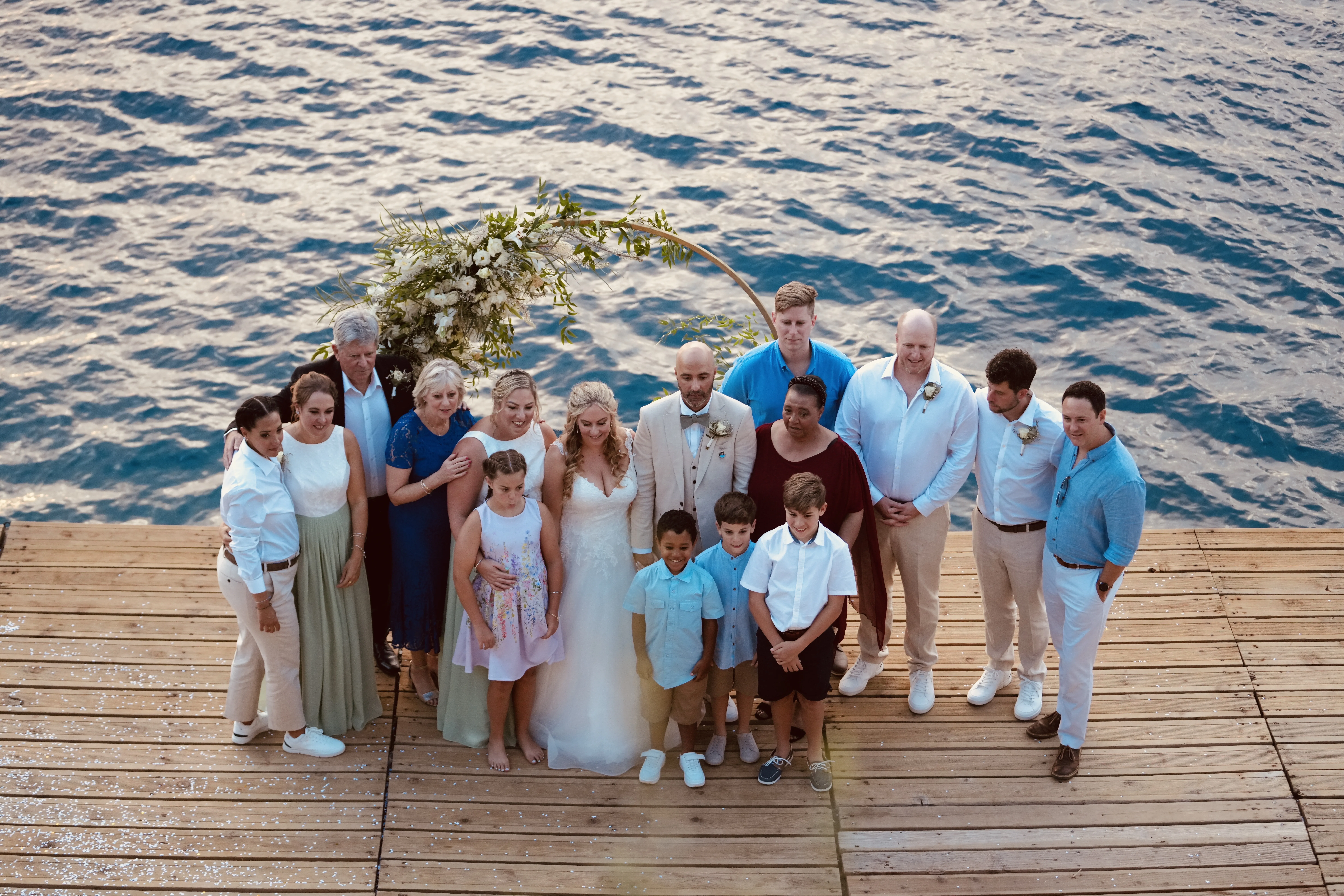 Extended family group photo at destination wedding celebration