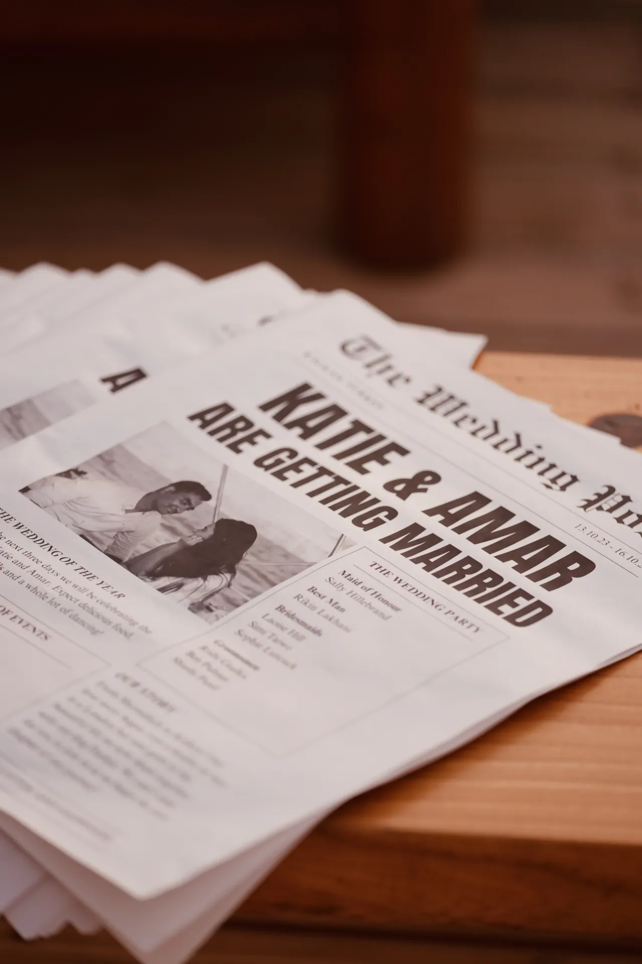 Custom newspaper-style wedding program with couple names