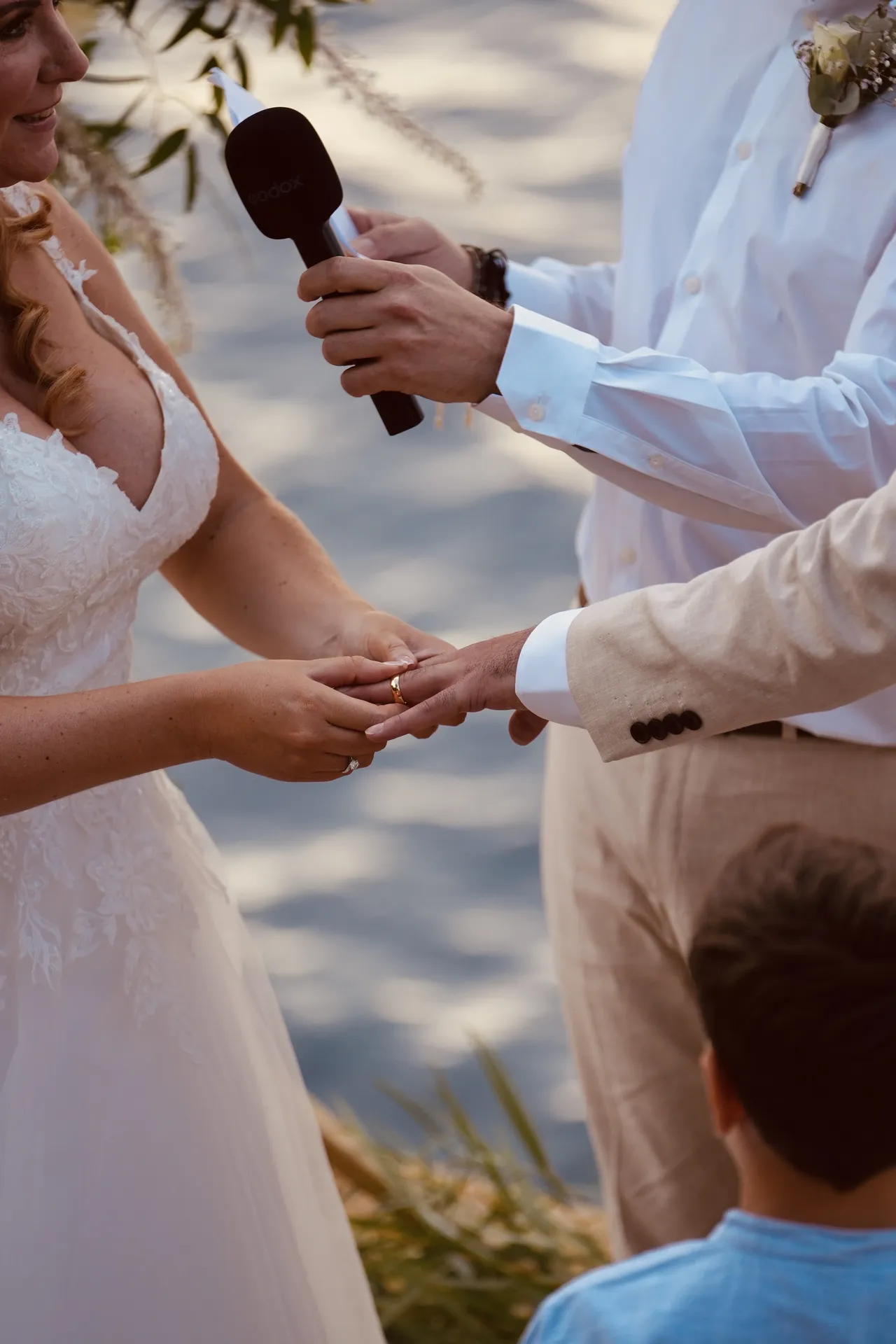 Officiant reading during waterfront wedding ceremony