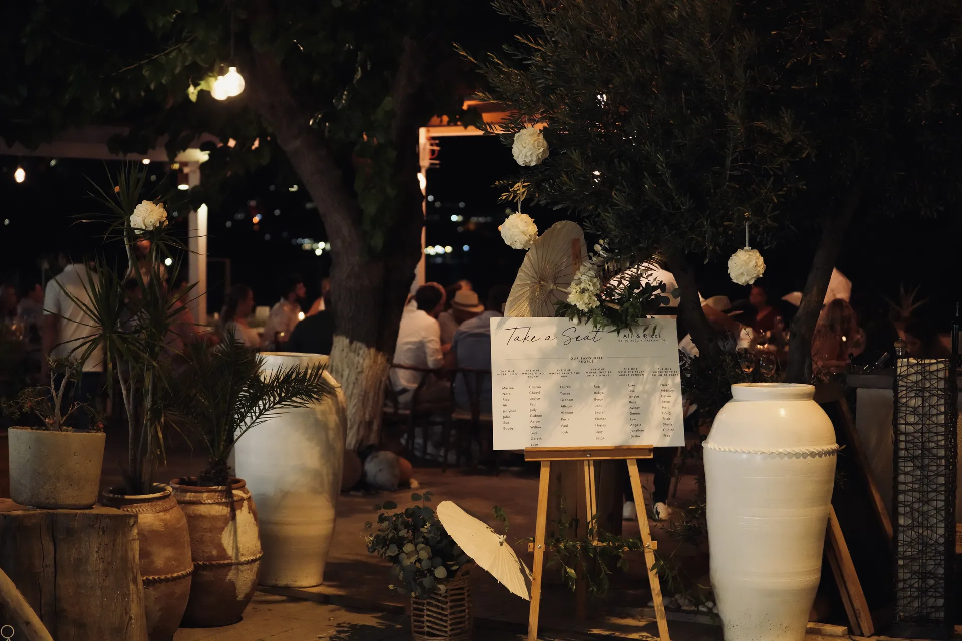 Take a Seat seating chart display with bohemian decorative styling